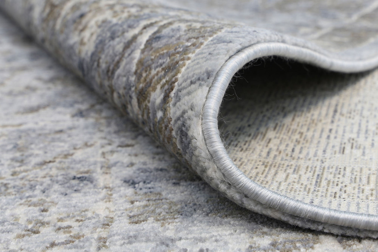 Close-up of a textured gray rug with a pattern