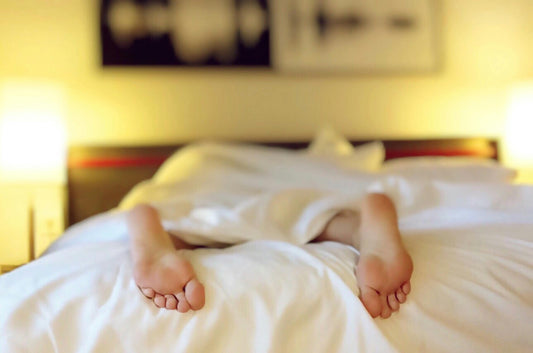 person sleeping on a warm cosy bed modern Australian bedroom from KK Lifestyle