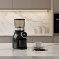 Black coffee grinder with digital display on a white background