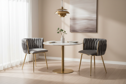 grey velvet designer dining chairs with grey back and golden legs, padded seats, modern dining area with white marble top dining table with golden legs, modern pendant light and wall art, timber flooring, soft daylight with curtain on windows
