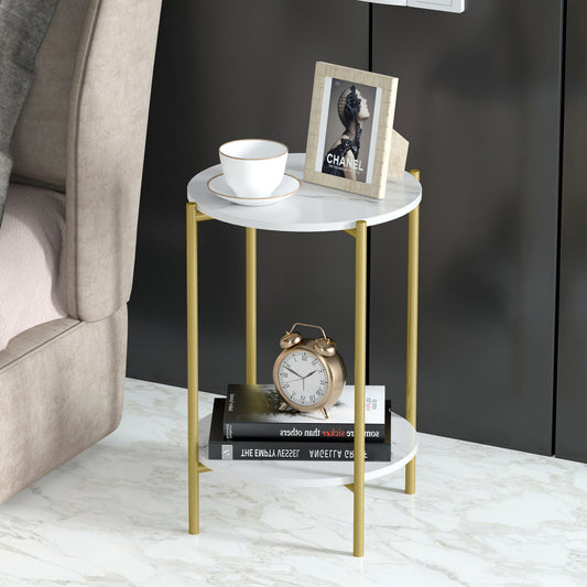 Small round marble table with gold legs, featuring a cup, books, and a clock on a neutral background.