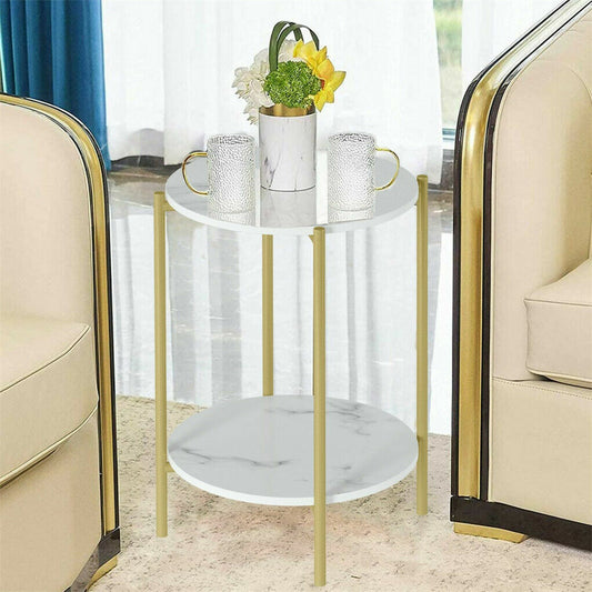 Round marble side table with gold legs in a living room setting